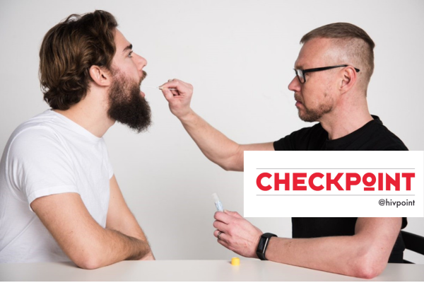 A Hivpoint employee takes a swab sample from the throat at Checkpoint service.