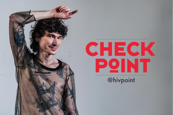 a trans person in a mesh shirt points their finger at the Checkpoint logo.