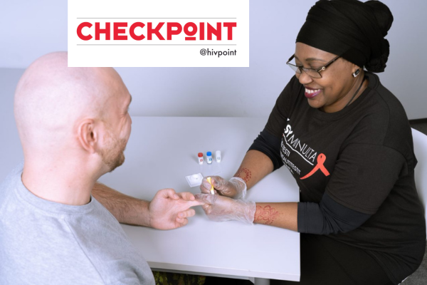 A Hivpoint employee takes an HIV rapid test from the customer's fingertip.