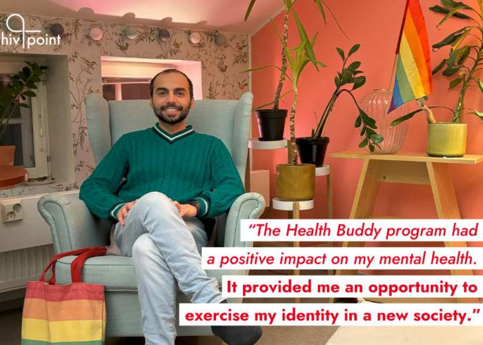 Hivpoint's Health Buddy Ali is smiling and sitting in an arm chair in a cozy, colorful room. The room is decorated with house plants and a Pride flag. On top of the photo, there's a quote: "The Health Buddy Program had a positive impact on my mental health. It provided me an opportunity to exercise my identity in a new society."