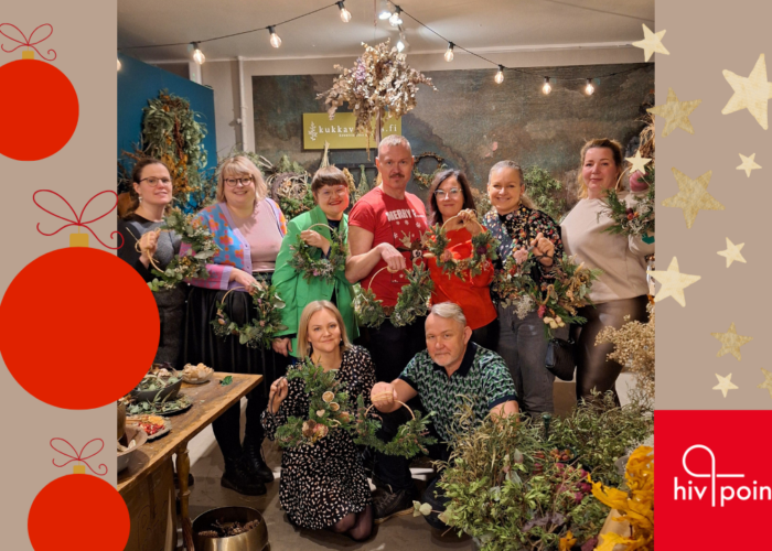 Hivpoint´s staff together holding DIY Christmas wreaths.