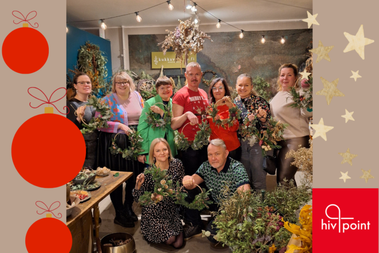 Hivpoint´s staff together holding DIY Christmas wreaths.